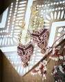 Autorskie kolczyki IMVELO z motywem lotosu wykonane z brazylijskiego sznurka Linhasita. Ręcznie robiona biżuteria handmade w stylu boho z ograniczonej kolekcji.